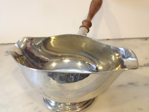 Vintage pewter sauce boat with wooden handle.